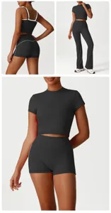 Vista dettagliata del crop top sportivo nero e dei pantaloncini yoga senza cuciture.