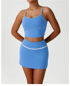Blue athletic two-piece yoga outfit detail, featuring a stylish crop top and matching skirt.