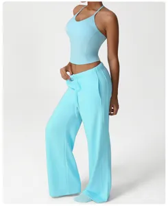 Women light blue athletic crop top and wide leg pants set for yoga, fitness and casual wear.