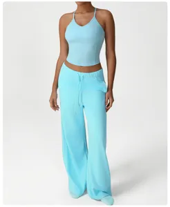 Close-up detail of light blue activewear set featuring a stylish tank top and wide-leg pants.