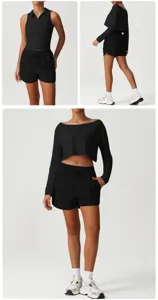 Detailansicht des schwarzen Sport-Crop-Tops und Shorts-Sets, zeigt Stoff und Passform.