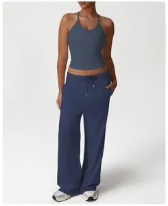 Comfortable activewear set with a stylish halter crop top and loose casual wide-leg pants.