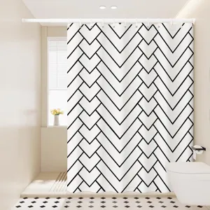 Detailed view of a modern black and white geometric pattern shower curtain in a clean bathroom.