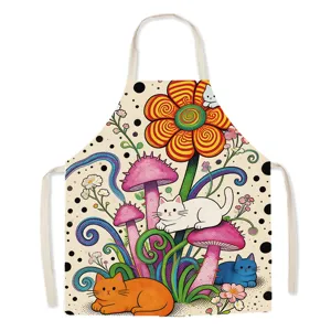 Détail de motif de chat et de champignon coloré sur tissu de tablier de cuisine en coton