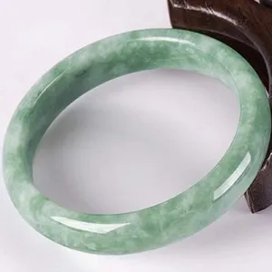 Elegant green jadeite bangle with floating flower design, Chinese style jade bracelet for women.