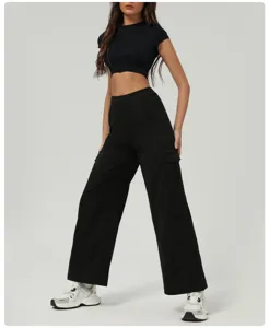Women black crop top and cargo pants set, casual streetwear outfit for daily wear.