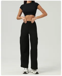 Black cargo pants and crop top set for women, casual street style high waist wide leg trousers.