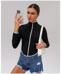 Women's slim fit long sleeve mock neck athletic jacket with contrast trim for sports fitness.