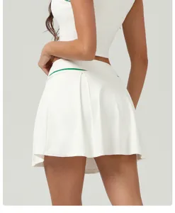 White high-waisted pleated tennis skirt detail view, lightweight quick-dry athletic wear.