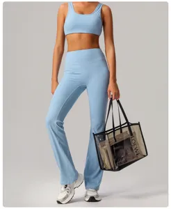 Light blue yoga set for women, high waist flare pants and sports bra for gym fitness activewear.