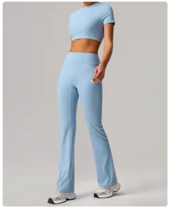 Light blue crop top high waist flare yoga pants set, activewear fitness workout outfit.