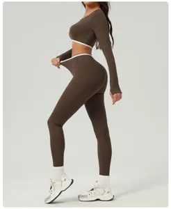 Detail view of women brown crop top and high waist yoga pants fitness activewear set.