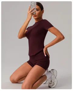 Detailed view of the women's seamless athletic yoga set in a rich burgundy color.