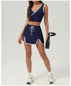 Women athletic tennis skirt set crop top sportswear activewear workout fitness outfits.