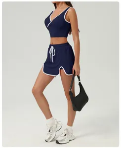 Detail view of women's navy athletic two-piece set, perfect for tennis and running.
