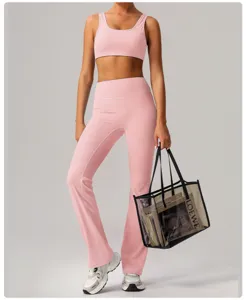 Pink nude-feel yoga set featuring a scoop-neck sports bra and high-waist flared pants.
