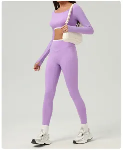 Purple two piece yoga set long sleeve crop top and high waist fitness leggings for women.