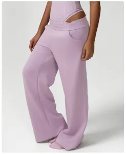 Detail shot of casual purple wide leg sweatpants with comfortable fit and side pockets.