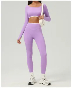 Purple long sleeve crop top and high waist yoga pants detail, activewear fitness workout set.