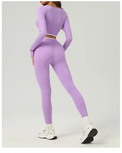 Detailed back view of women's purple long sleeve crop top and high waist yoga leggings set.