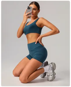 Detailed view of the athletic yoga set showing high-waisted shorts and supportive sports bra.