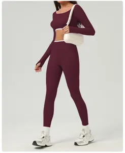 Detail view of the athletic long sleeve crop top and high waist yoga pants matching set features.