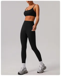 Detailed view of women athletic yoga set, high waist tight leggings and sports bra for fitness.