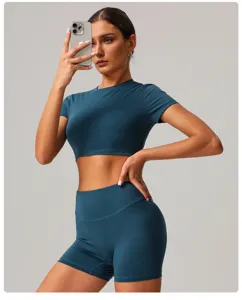 Teal crop top and high waist shorts yoga set, soft stretch athletic wear for gym and fitness.
