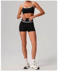Black contrast trim athletic sports bra and high waist yoga shorts fitness set view.