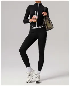 Black contrast trim long sleeve sports jacket and slim yoga pants set for active fitness workouts