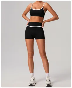 Black contrast trim athletic sports bra and high waist shorts activewear detail view.