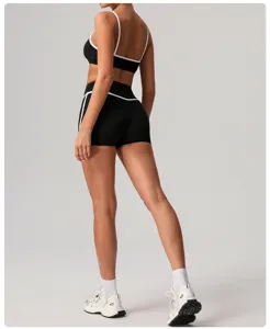 Black high waist yoga shorts and sports bra set featuring contrast white trim for fitness women.