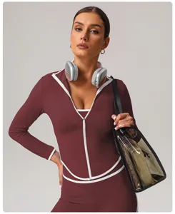 Slim fit contrast long sleeve yoga jacket detail showing stand collar and piping trim.