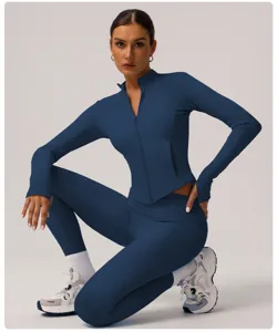 Women's athletic zip-up jacket and high-waist yoga pants fitness activewear set.
