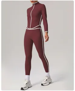 Close-up view of women's contrast piping athletic zip-up jacket and matching leggings set for fitness.