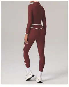 Detailed back view shot of women's long sleeve contrast piping fitness activewear top.