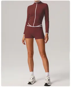 Maroon athletic long sleeve top and high waist shorts set with white piping details.