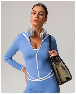 Detail view of the stylish athletic zip-up yoga jacket with contrast trim and slim fit design.