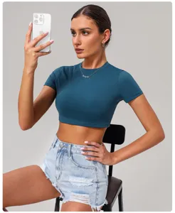 Quick-dry tight yoga crop top for women, solid color short sleeve athletic fitness shirt.