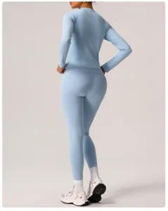 Light blue long sleeve yoga top and high waist leggings set for women fitness and workout.