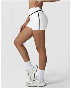 Detail shot of high-waisted yoga shorts with black contrast piping, tight fit activewear