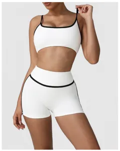 Color-block high-waisted yoga athletic set, featuring contrast trim bra and supportive shorts.