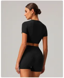 Detailed back view of women black seamless activewear crop top and high waist yoga shorts.