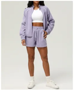 Women textured activewear set featuring a zip-up jacket and matching shorts for cozy yoga workouts.