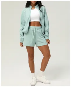 Textured two-piece tracksuit set with long sleeve zip jacket and casual shorts for women.