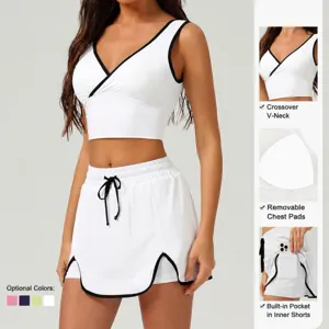 Women white athletic crop top and sports skirt two piece workout set with stylish black trim.
