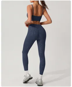 Detailed view of women dark blue activewear set with abstract pattern yoga leggings & bra.