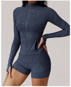 Detailed view of the dark blue foil print long sleeve zip yoga jacket and matching shorts set.