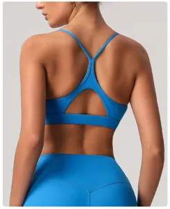 Soutien-gorge de sport bleu à bretelles, haut de fitness yoga respirant et séchant.