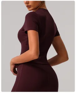 Burgundy short sleeve athletic top detail, slim fit sportswear for gym running yoga.